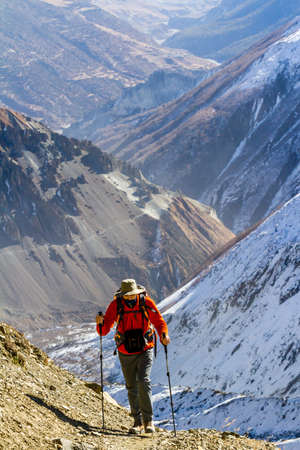 Annapurna, Nepal - November 13, 2015: Tourist going up on the way to Thorong La Pass (5416 m), Annapurna Trek, Himalayas, Nepal.のeditorial素材
