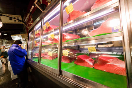 Tokyo, Japan - January 15, 2010: Early morning in Tsukiji Fish Market. The first customers buy fresh tuna.のeditorial素材