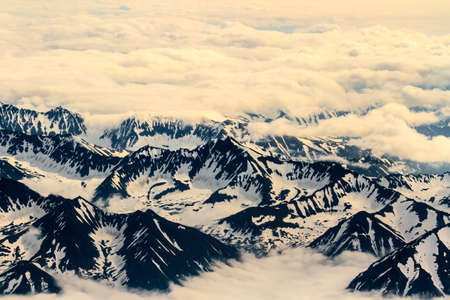 Aerial view of the mountains from the airplane porthole. Travel conceptの写真素材