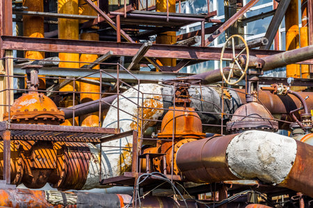 Close up image of rusty steel pipes in the plant. Industrial concept.