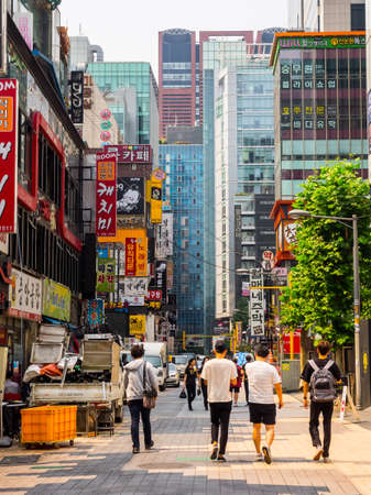 Seoul, South Korea - June 16, 2017: People walking down a small street in Seoul downtown.のeditorial素材