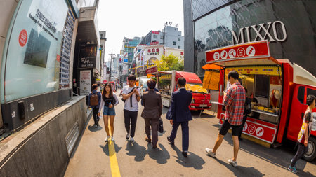 Seoul, South Korea - June 16, 2017: People walking down a small street in Seoul downtown.のeditorial素材