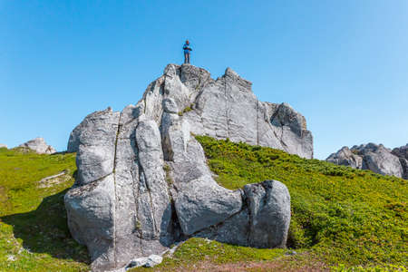 Kamchatka, Russia - July 10, 2018: Hikers climbing to the mountain.のeditorial素材