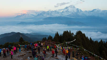 Ghorepani, Nepal - November 14, 2018: Tourists meeting the dawn on Poon Hill. It's the famous view point in Ghorepani village in Annapurna conservation area, Nepal.のeditorial素材