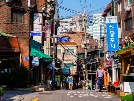 Seoul, South Korea - June 8, 2017: People walking down the small narrow street Seoul.のeditorial素材
