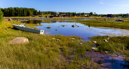 Typical local small Russian village near the lake, Republic of Karelia.の写真素材