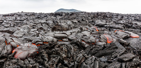 Volcanic landscape with lava. Hot lava flow near active Volcano Tolbachik, Kamchatka, Russia.