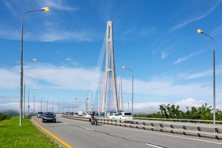 Vladivostok, Russia - July 26, 2022: Cars drivind along the Cable-stayed Russky Bridge to island Russkiy in Vladivostok, Primorsky Krai, Russiaのeditorial素材
