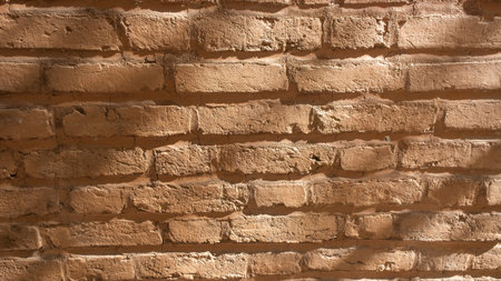 Rough old grunge orange brick wall texture backgroundの写真素材