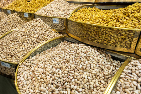 Pistachios in shell, fried, with salt, with saffron, raw at market in Tehran, Iranの写真素材