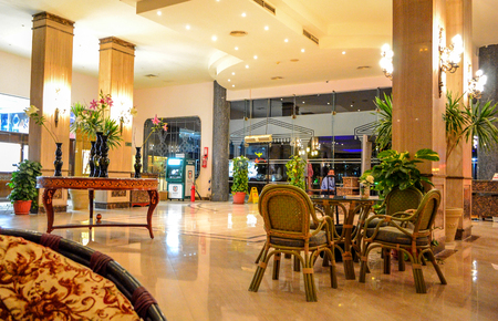 Hurghada, Egypt - May 15th, 2018: Interior view of the hotel lobby in Egypt, Hurghada. Places for recreation tourists. Tables and chairs.のeditorial素材