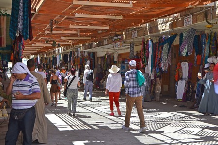 Tourists walk through the eastern bazaar in Egypt. Bazaar in Luxor, near the temple of Queen Hatshepsut.のeditorial素材