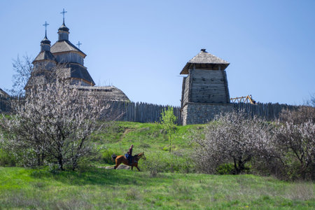 National Reserve Khortytsia. The center of the medieval Cossacks Zaporizhzhya Sich fortified with a stockade. Cossack rides a horse, performance.のeditorial素材