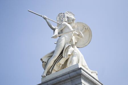 Berlin, Germany - 4th June, 2019: Antique white marble monument against the blue sky. White beautiful statue on the bridge near Museum Island, Berlin, Germany. Bottom up view.のeditorial素材