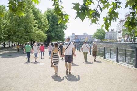 Berlin, Germany - 4th June, 2019: A group of tourists on excursions in Museum Island in Berlin, marching after a guide during a sightsing tour.のeditorial素材