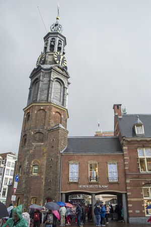 Amsterdam, Netherlands - 5th June, 2019: Muntoren or Mint Tower - a medieval tower in the Netherlands. One of the city's vibrant historical and architectural monuments, one of the symbols of Amsterdam.のeditorial素材