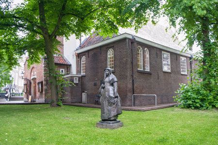 Amsterdam, Netherlands - 5th June, 2019: Beginage quarter, Begenhof courtyard of the Monastery of Begins in Amsterdam. The refuge of single women, near Spey Square. English Church in the background.のeditorial素材