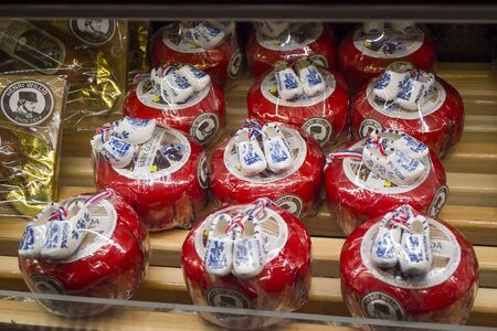 Zaanse Schans, Netherlands - 5th June, 2019: Holland gouda Henry Willig cheese in a shop window beautifully packaged with small ceramic klumps. Traditional souvenir from Holland. Selective focuse.のeditorial素材