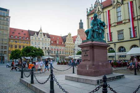 Wroclaw, Poland - June 3th, 2019: Monument to Count Alexandre Fredro - Polish comedian, poet and memoirist. Wroclaw, medieval market square in the evening. One of the largest market squares in Europe.のeditorial素材
