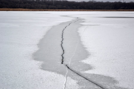 Ice breaking across the river, danger in winterの写真素材