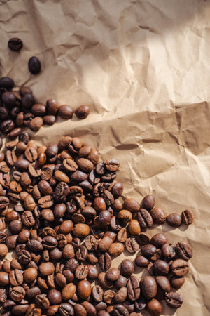 Coffee beans on crumpled paper background, top viewの写真素材