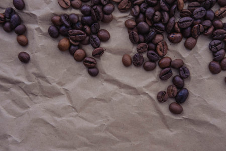 Coffee beans on crumpled paper. coffee background.の写真素材