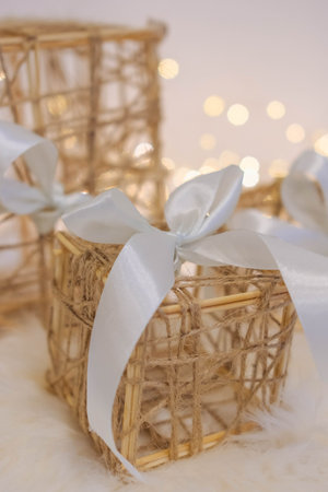 Wedding decoration in the form of a wicker basket with a white bow
