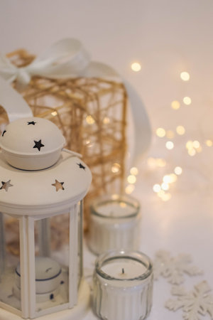 Christmas decoration with candles and snowflakes on a white background.の写真素材