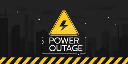 The banner of a power outage with a warning sign the one is on the background of the night city without electricity.のイラスト素材