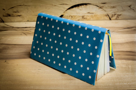 fan-shaped arrangement of brightly colored booksの写真素材