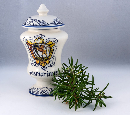 Ceramic vase with leaves of rosemaryの写真素材
