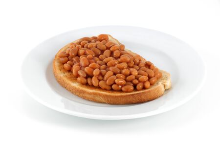 plate of beans on toast isolated on whiteの写真素材