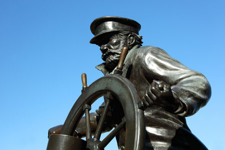 CHICAGO, ILLINOIS/USA-OCTOBER 14 2015: Captain on the Helm sailors memorial statue at Navy Pier...