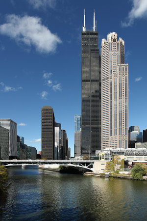 CHICAGO, ILLINOIS/USA-OCTOBER 15 2016: Chicago river and tall buildings with blue sky on October 15...