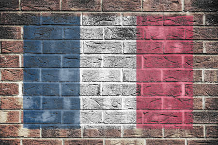 France flag on old brick wall backgroundの写真素材