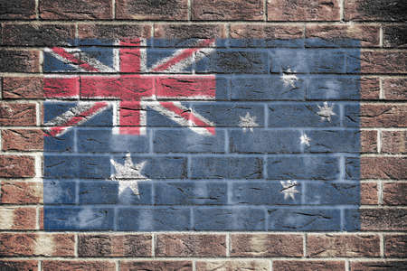 Australia flag on a brick wall backgroundの写真素材