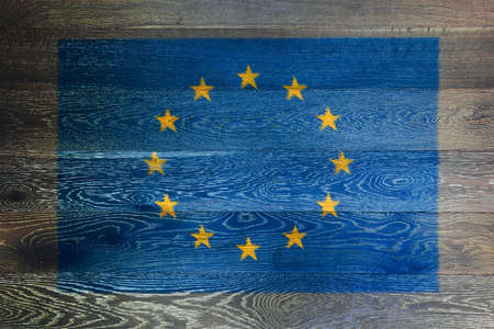 European union flag on rustic old wood surface backgroundの写真素材