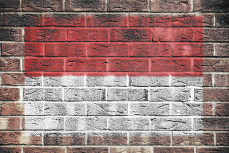 Indonesia flag painted on brick wall backgroundの写真素材
