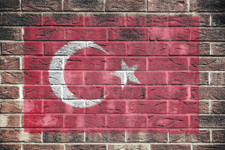 Turkey flag on a brick wall backgroundの写真素材