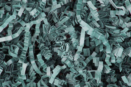 Green paper background texture shredded and crimpedの写真素材