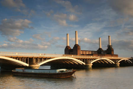 River Thames with barge Grosvenor Rail Bridge and Battersea Power Stationの写真素材