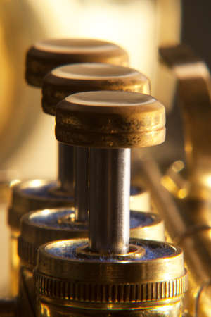 Trumpet valves brass in a line with differential focusの写真素材