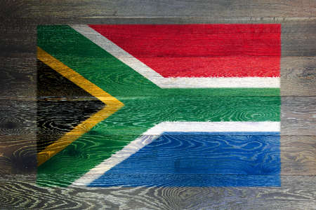 South Africa flag on rustic old wood surface backgroundの写真素材
