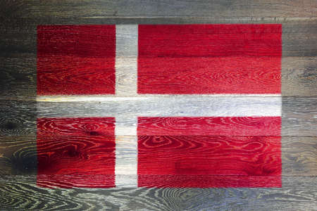 Denmark flag on rustic old wood surface backgroundの写真素材