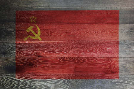 USSR flag on rustic old wood surface red yellow hammer sickle CCCPの写真素材