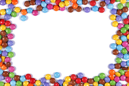 Multi coloured halloween candy sweet border on white