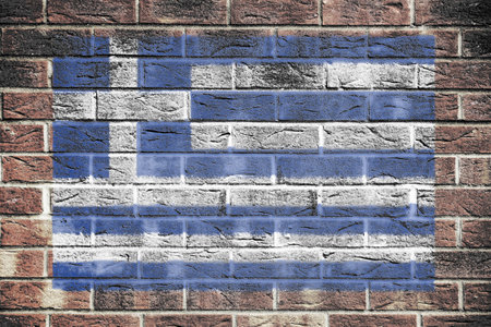 Greece flag painted on brick wall backgroundの写真素材