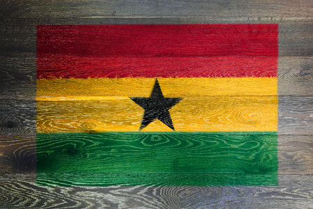 Ghana flag on rustic old wood surface backgroundの写真素材