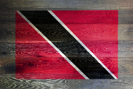 Trinidad and tobago flag on rustic old wood surface backgroundの写真素材