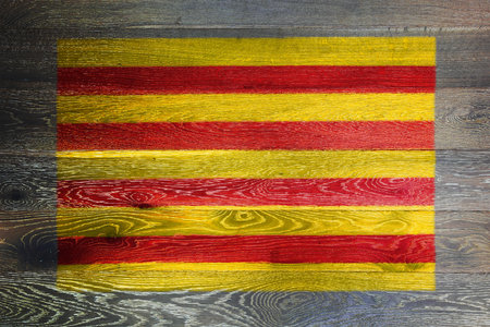 Catalonia flag on rustic old wood surface backgroundの写真素材